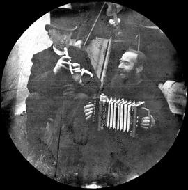 Capuchin Friar playing an Accordion