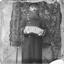 Man playing a Concertina