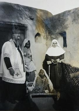 Archbishop Sylvester Mulligan anointing the sick in an India village